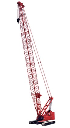 Red crane lifting heavy loads on a construction site, showcasing industrial strength and efficiency.