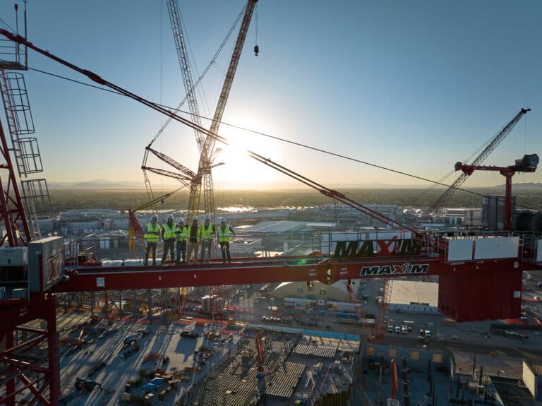 Maxim workers on a tower crane during job - importance of efficient and reliable lifting solutions concept