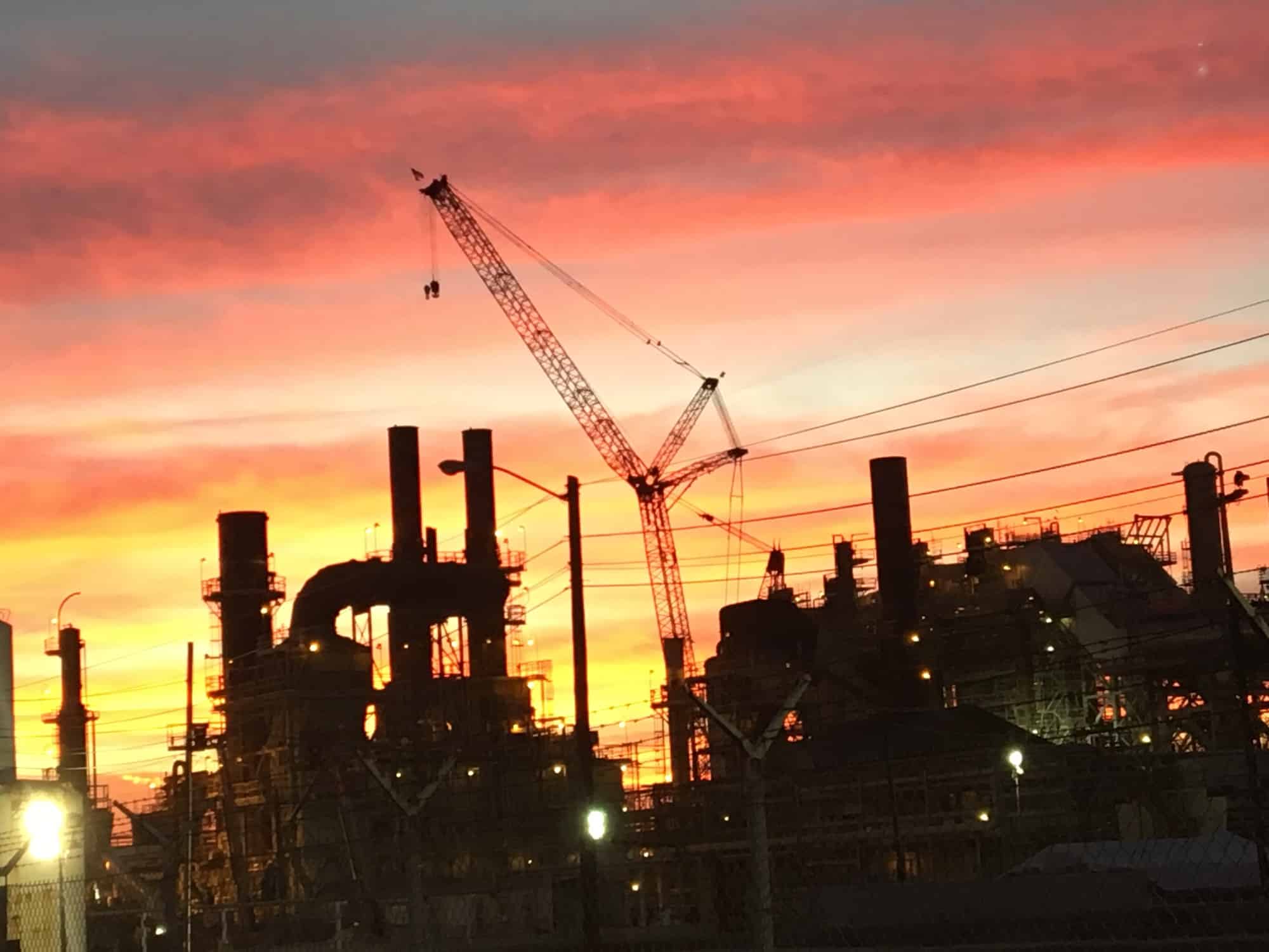 industrial construction sunset shot with Maxim crane silhouette