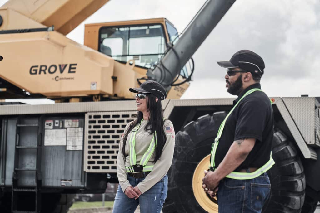 Maxim Crane Workers standing by a crane