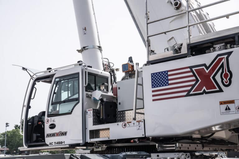 Maxim crane AC 7450-1 features a spacious operator cabin and advanced machinery design.