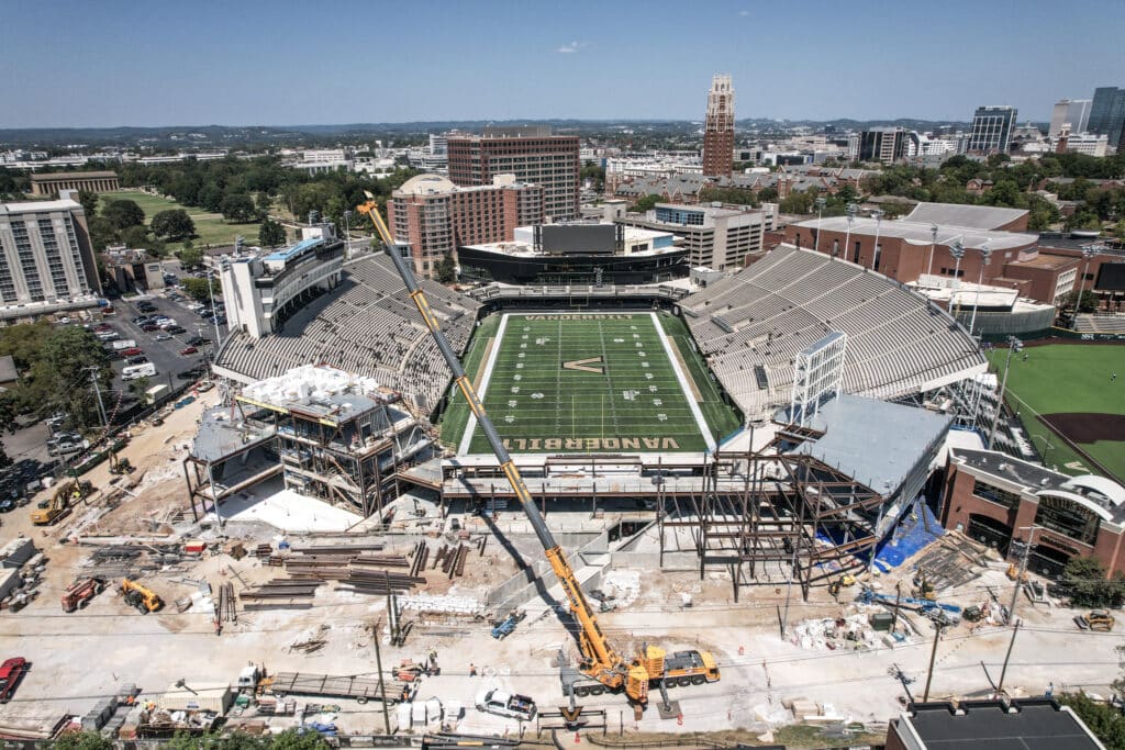 Vanderbilt Stadium construction using mobile cranes in progress, showcasing renovation and modern upgrades.