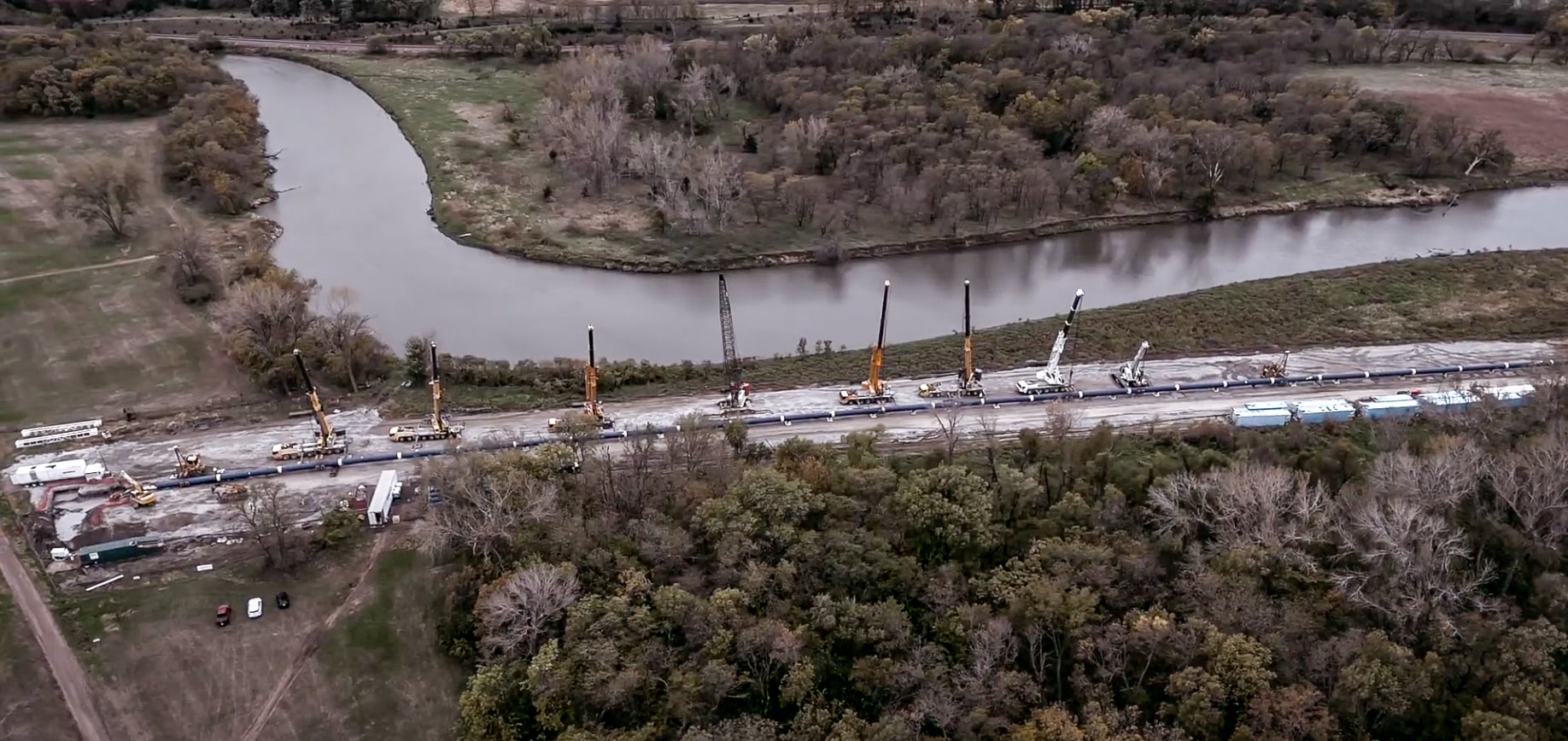 Platte River construction site featuring cranes and machinery in an aerial view.