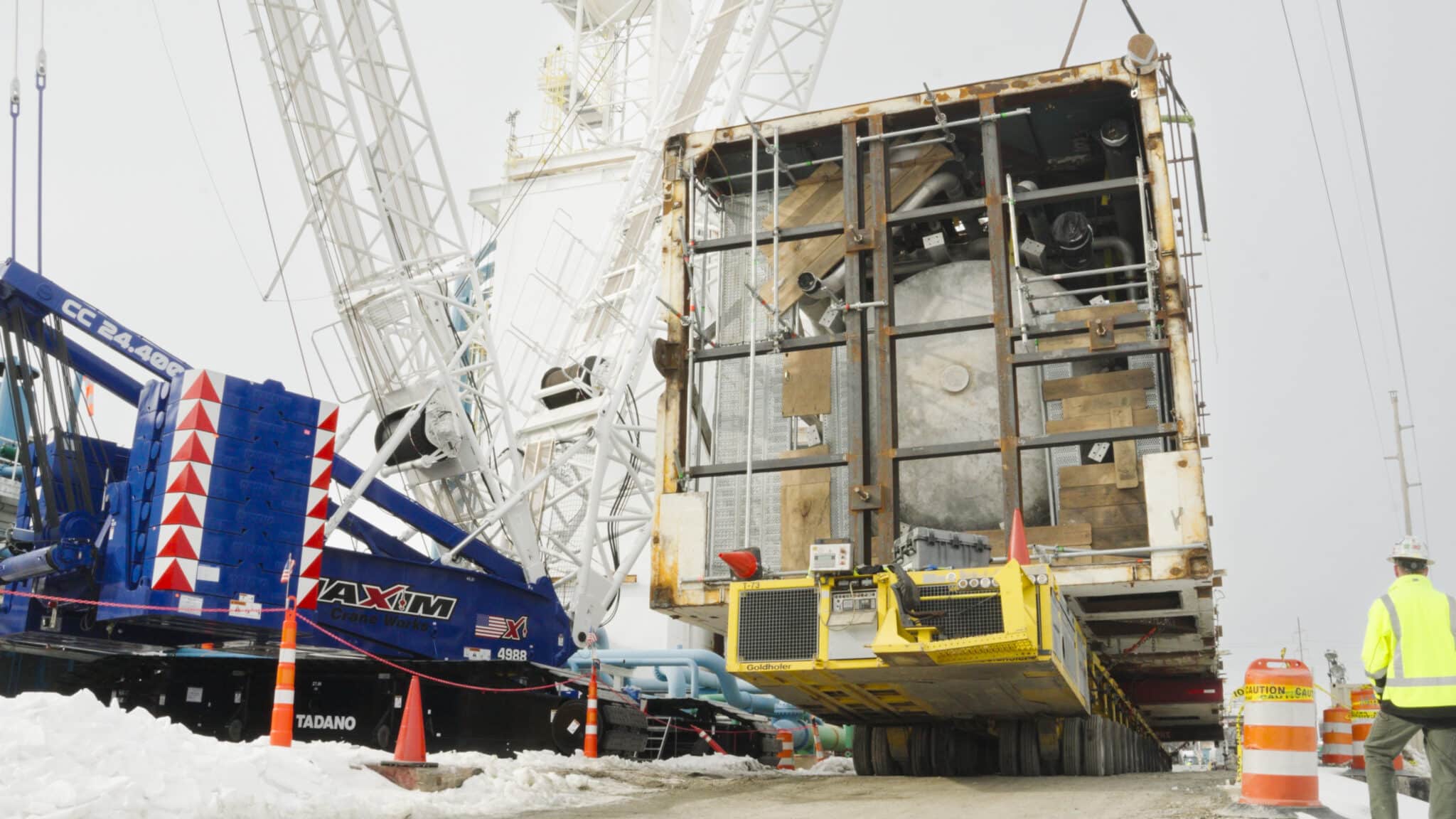 Heavy machinery unloading cargo at a shipping yard, showcasing efficient cargo-loading operations.