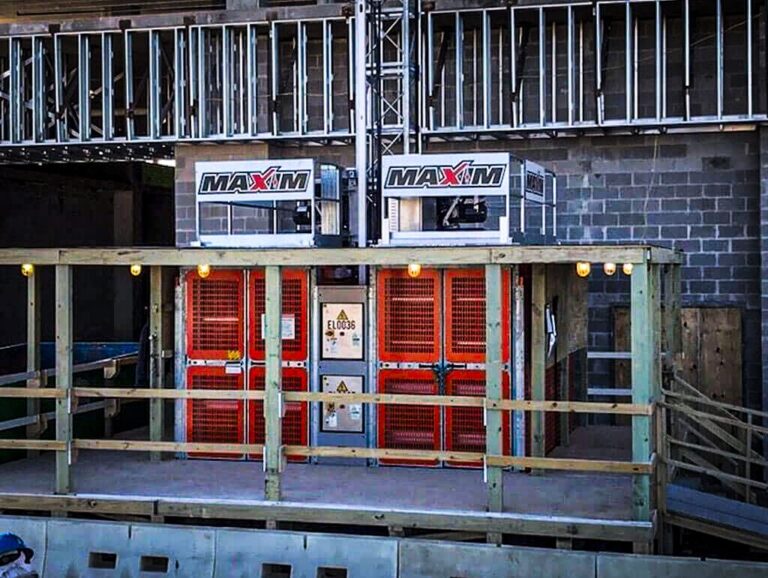 Maxim construction elevator at a job site, ensuring safe and efficient material transport.